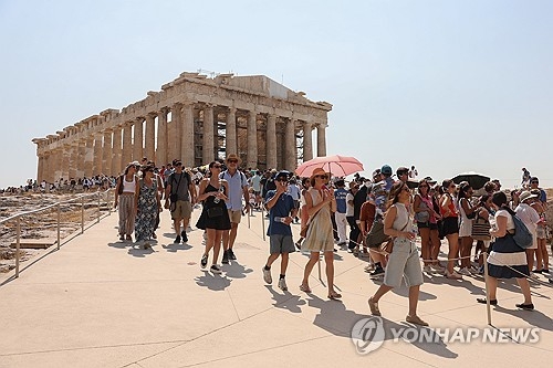 Tourists visit the Acropolis in Athens, Greece, on July 21, 2026, amid a heat wave. [EPA]