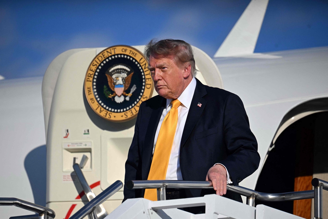 US President Donald Trump disembarks from Air Force One at Morristown Municipal Airport in Morristown, New Jersey, on Friday (local time). [AFP]