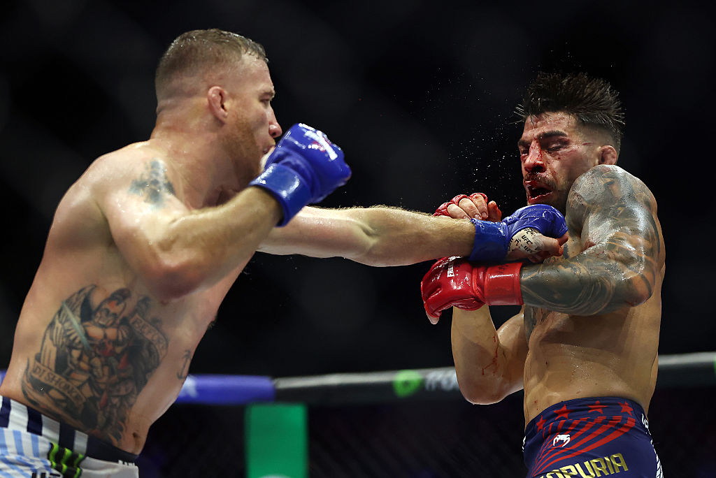 Justin Gaethje throws a punch at then-champion Ilia Topuria during their bout at the UFC White House event in June. [Getty Images]