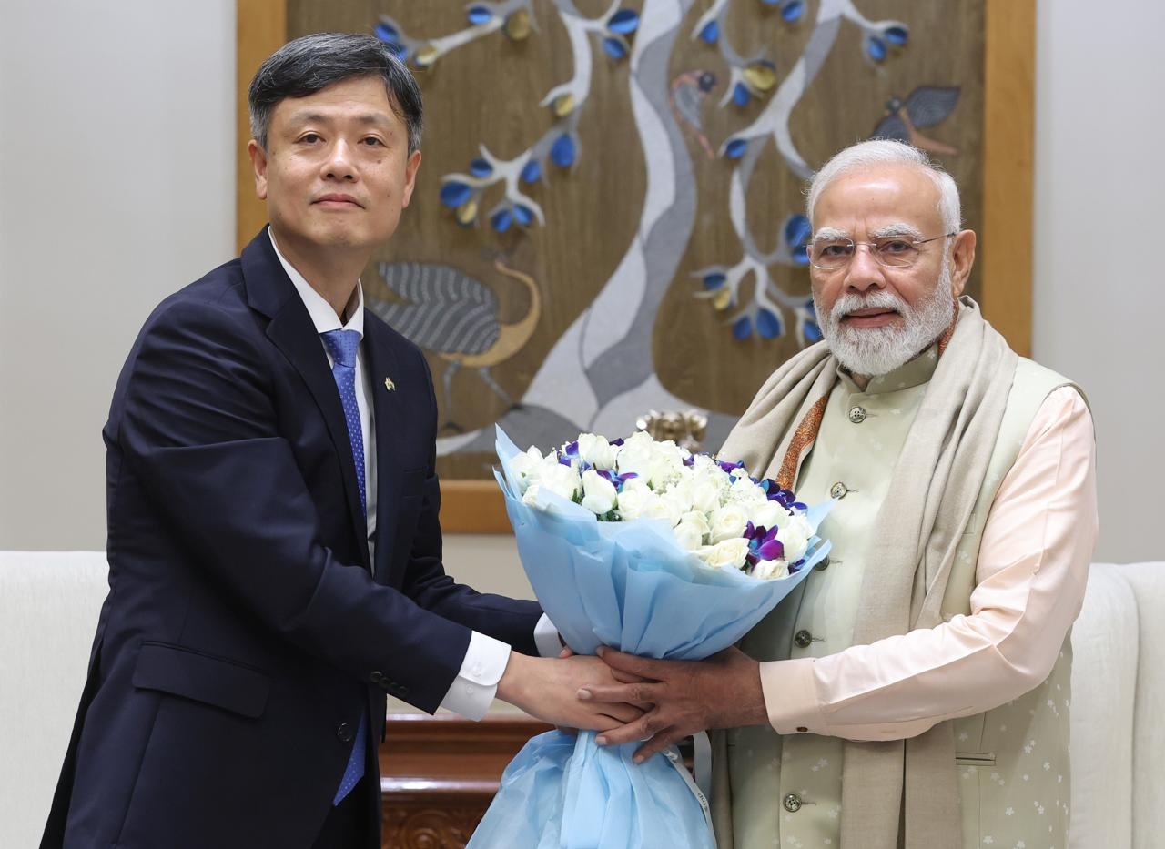 Krafton Chairman Chang Byung-Gyu poses for a photo with Indian Prime Minister Narendra Modi in New Delhi on Friday. (Krafton)