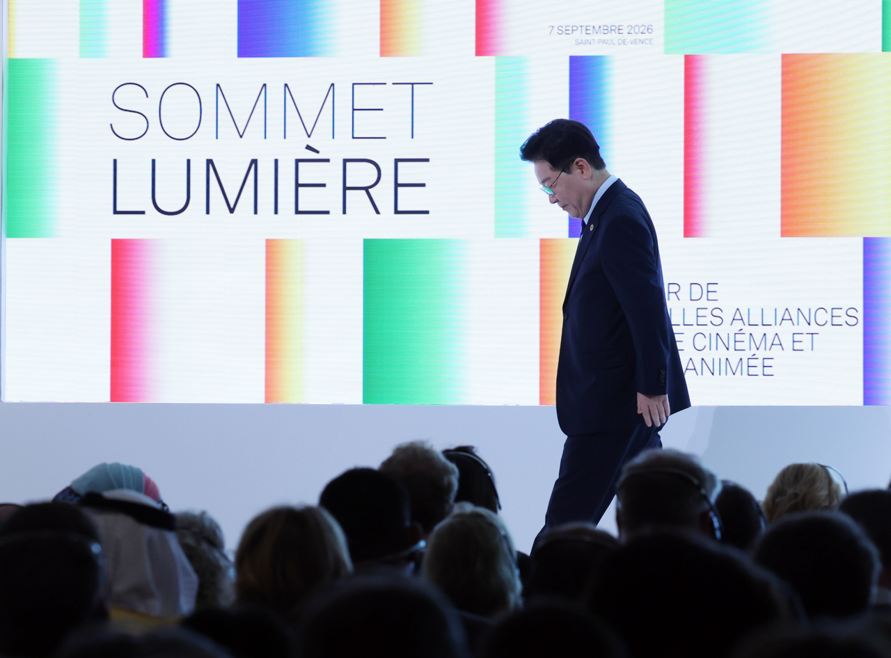 President Lee Jae Myung walks back to his seat after delivering the opening address at the Lumiere Summit, an international film and audiovisual summit, at the Fondation Maeght in Saint-Paul-de-Vence, southern France, on Monday. South Korea and France co-chaired the summit. (Yonhap)