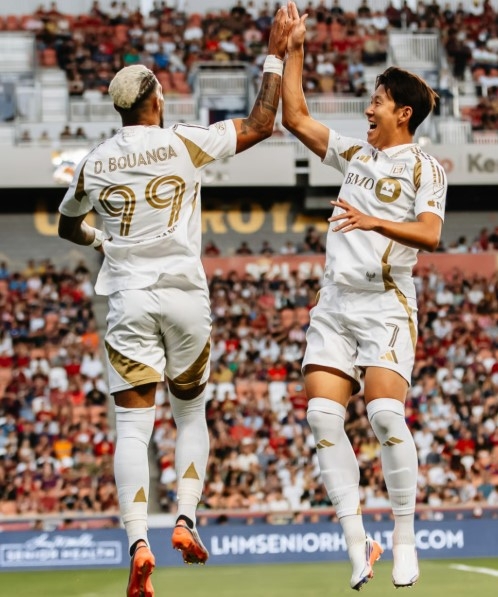 Son Heung-min (right) celebrates with Denis Bouanga after a goal. 　　(LAFC)