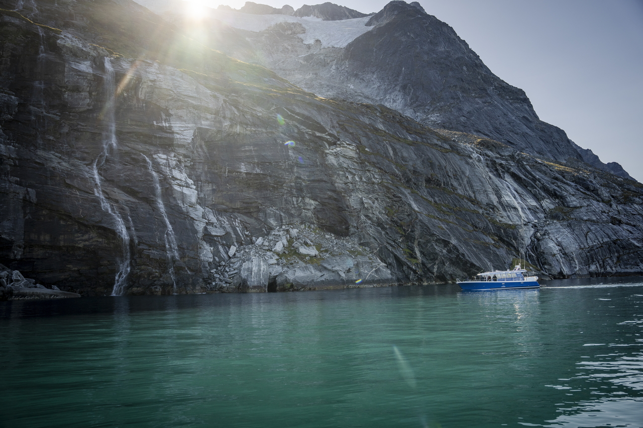 A boat sails near Qoornoq, Greenland, in September. (EPA-Yonhap)