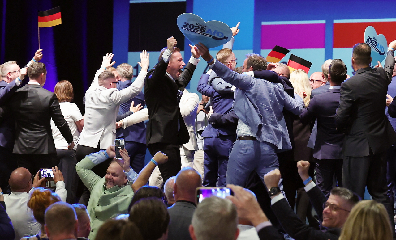 People cheer exit poll results at an election night event for the far-right Alternative for Germany party in Magdeburg, Germany, on Sunday (local time).