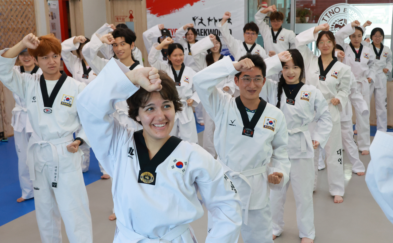 This photo, taken on Aug. 12, 2026, shows foreign students learning taekwondo, a Korean martial art, at a gym in Busan, 330 kilometers southeast of Seoul. (Yonhap)