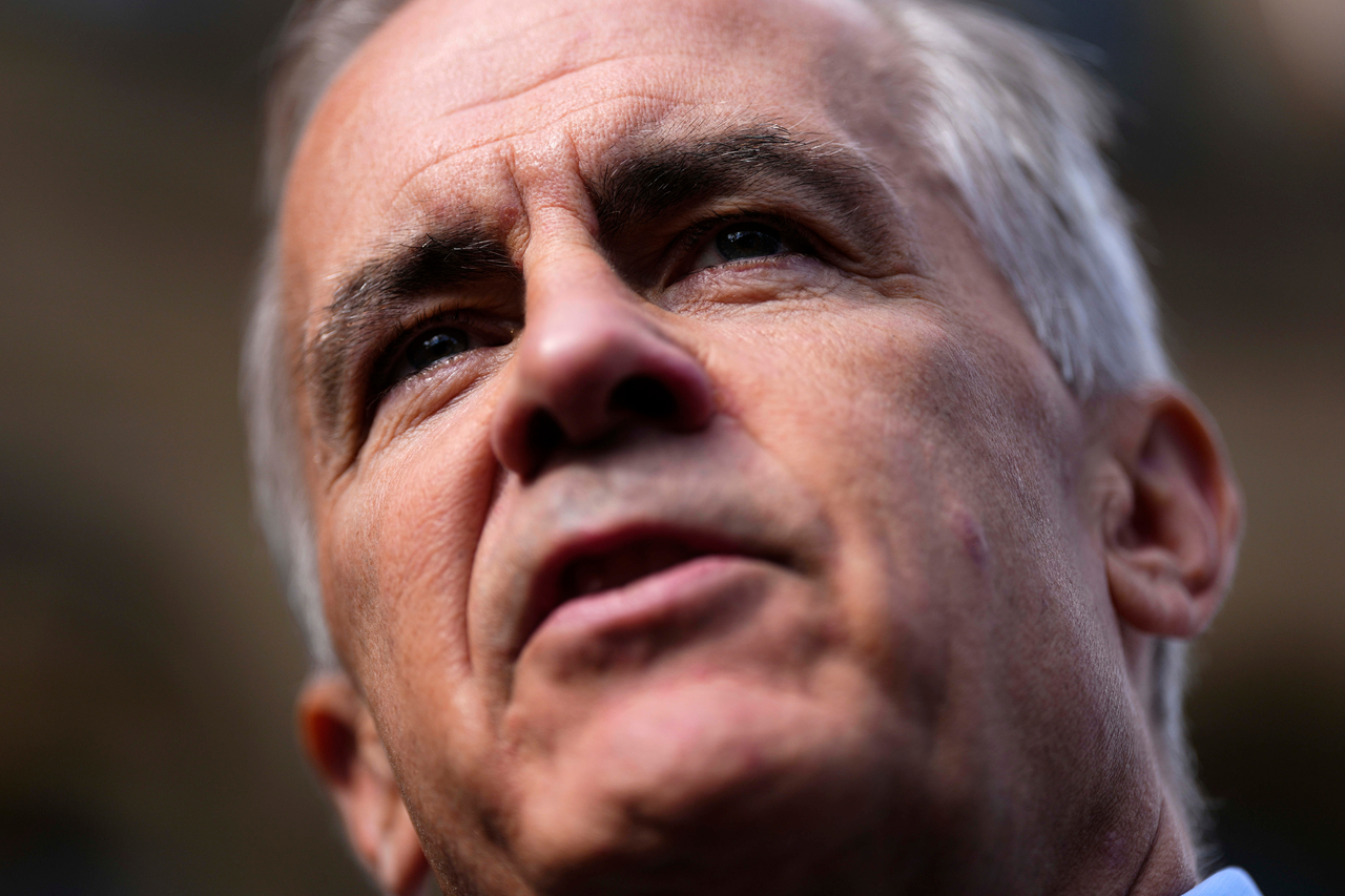 Canadian Prime Minister Mark Carney arrives at the Prime Minister's Office and Privy Council building in Ottawa and speaks with reporters, Sept. 1 (local time).