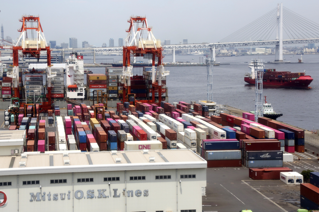 Containers sit at a port in Yokohama, south of Tokyo, Japan, in June 2020. [AP]
