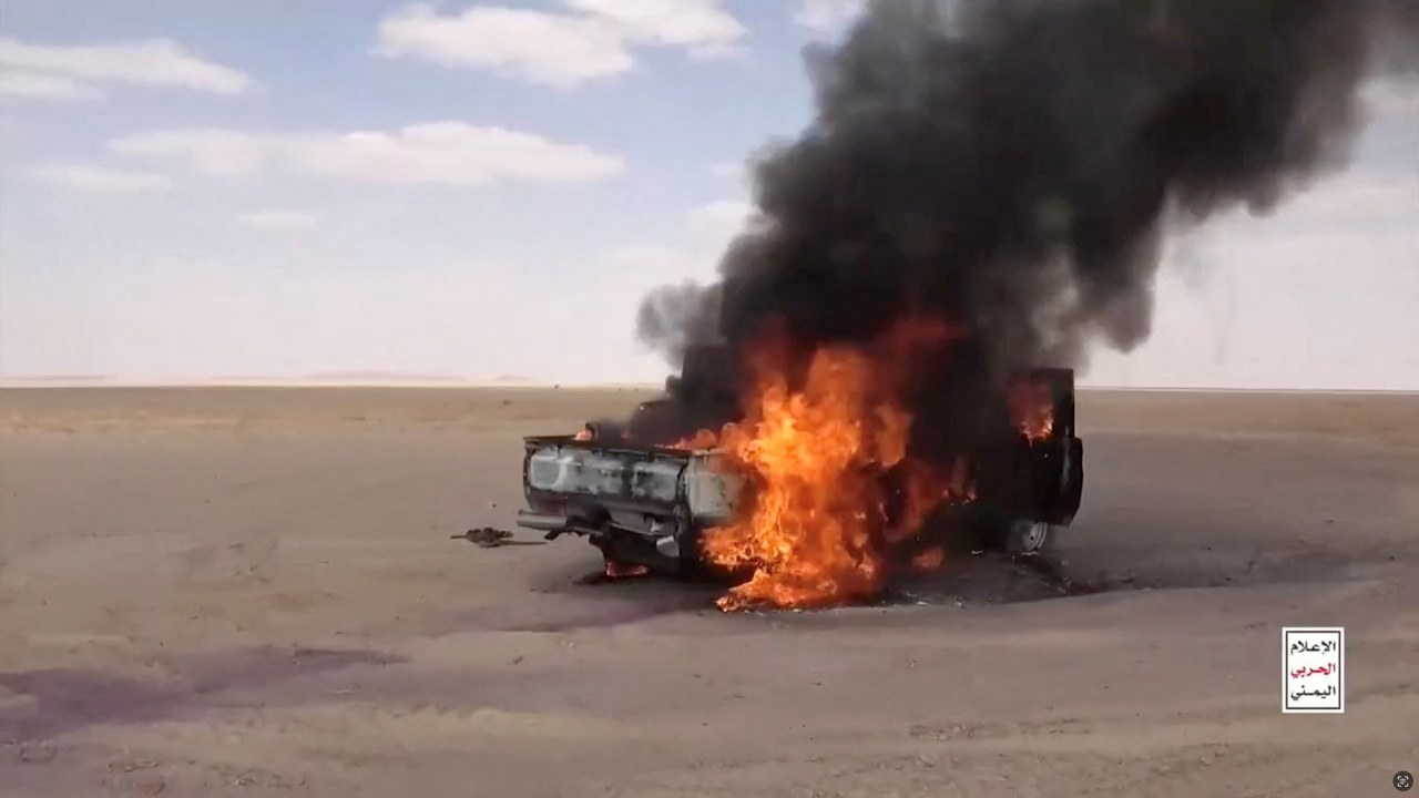 A vehicle burns after being hit in a Houthi attack during clashes with Saudi-backed forces in Yemen's Al Jawf region. (Reuters)