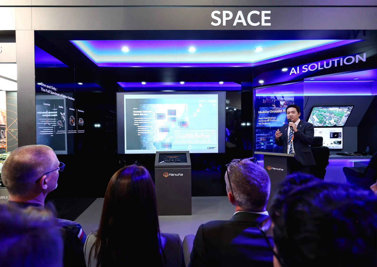 A Hanwha Systems official introduces the company's space AI solution at MSPO 2026 in Poland. (Hanwha Systems)