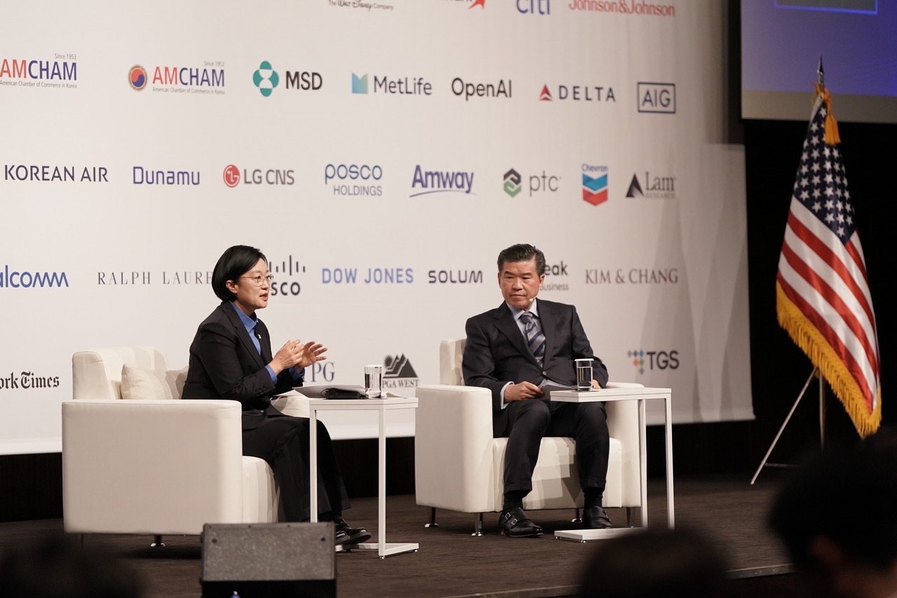 Prime Minister Han Seong-sook (left) speaks during an onstage conversation with AmCham Chair and CEO James Kim at The Shilla Seoul on Friday. (AmCham)