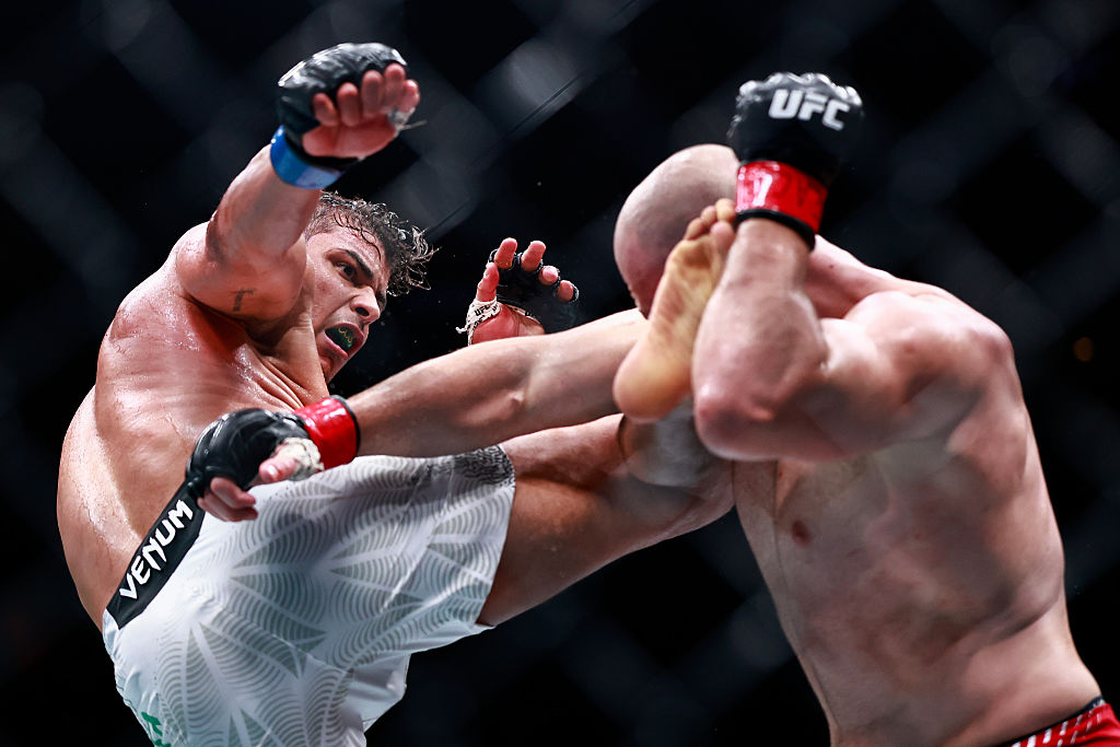 Paulo Costa (left), who moved up to light heavyweight, lands a high kick on Azamat Murzakanov at UFC 327 in April. (Getty Images)