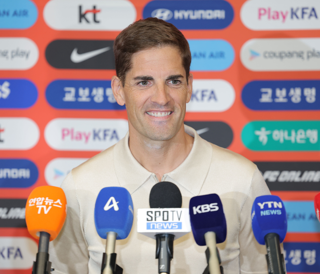 Robert Moreno, interim head coach for the South Korean men's national football team, listens to a question from a reporter at Incheon International Airport, west of Seoul, on Sept. 13, 2026. (Yonhap)