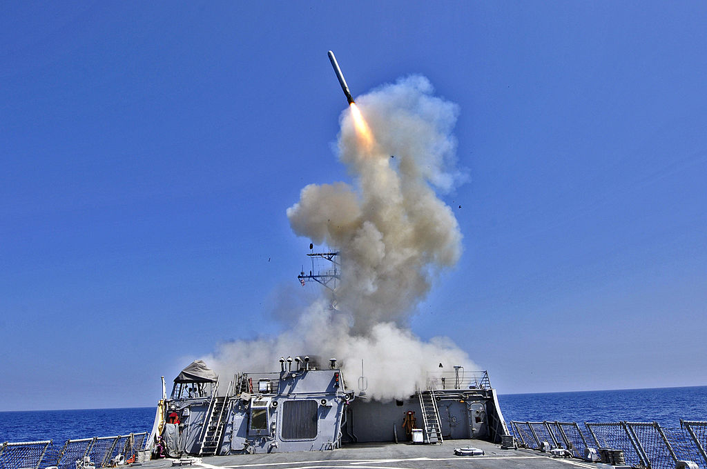 The USS Barry, a US Navy guided-missile destroyer, fires a Tomahawk cruise missile in the Mediterranean Sea. [US Navy]