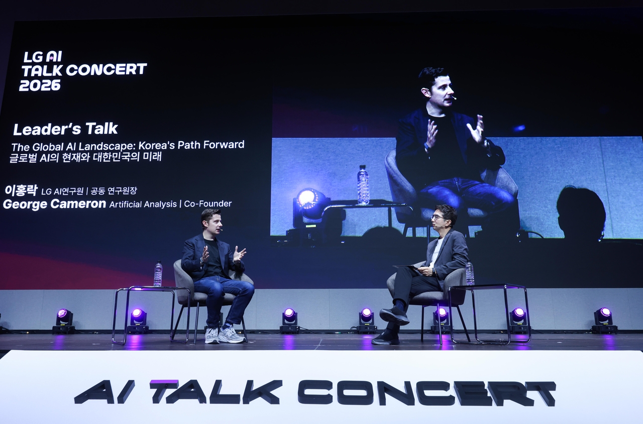 LG AI Research Co-head and Chief Sciece Officer Lee Hong-lak and Geroge Cameron, co-founder of Artificial Analysis speaks during LG AI Talk Concert in Seoul on Monday. (LG)
