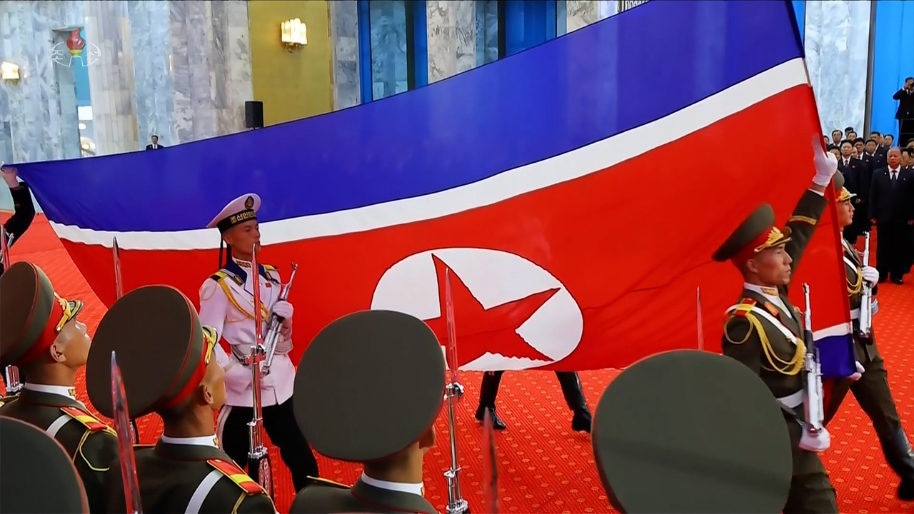 This image captured from the North's official Korean Central Television on Thursday shows a flag-raising ceremony and an oath-taking gathering to mark the 78th founding anniversary of the republic at the Pyongyang Assembly Hall on Wednesday. (Yonhap)