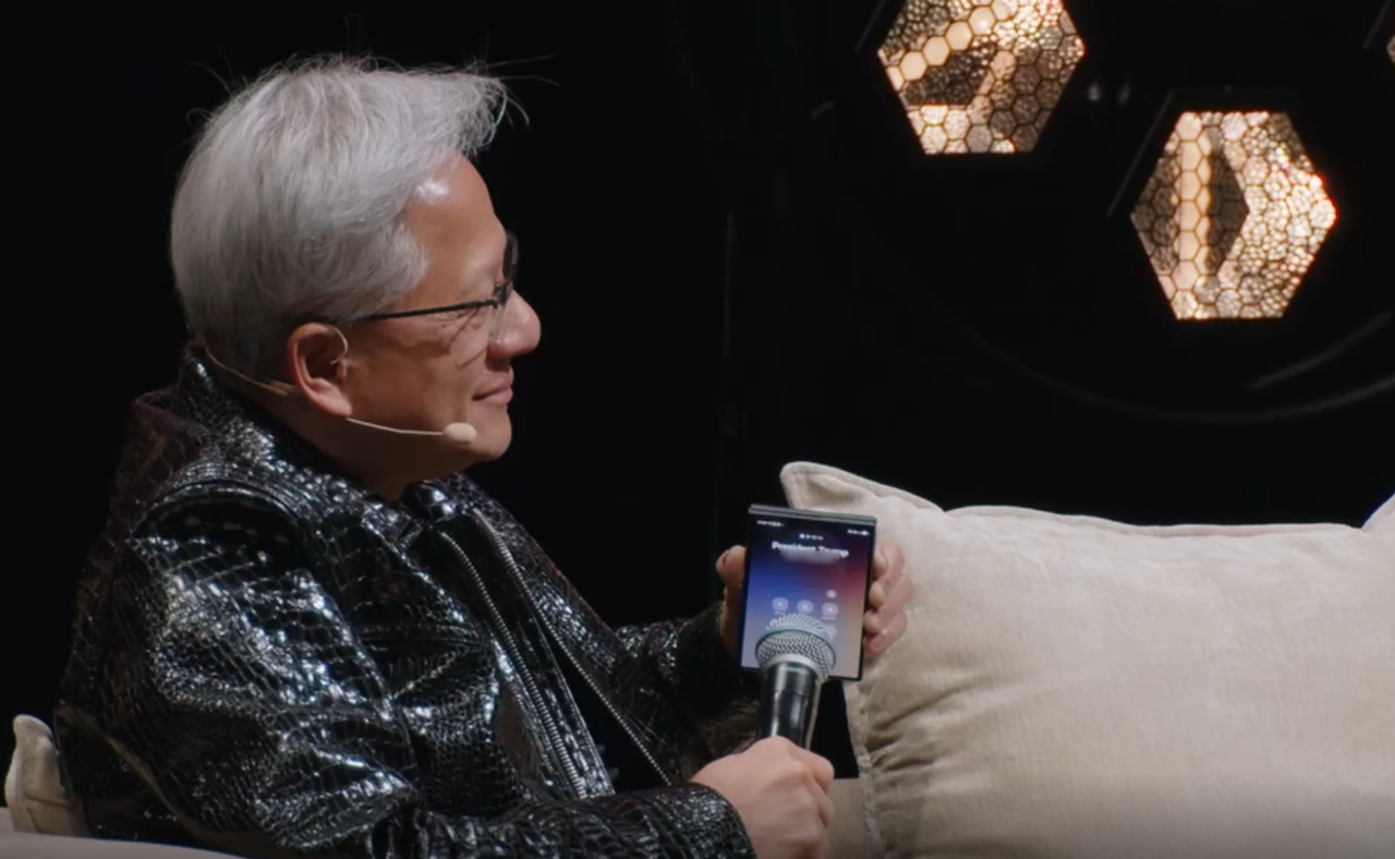 Jensen Huang receives a call from President Trump with his Galaxy Z Fold8 at the "All-In Summit 2026"  in Los Angeles on Monday. (X @theallinpod)