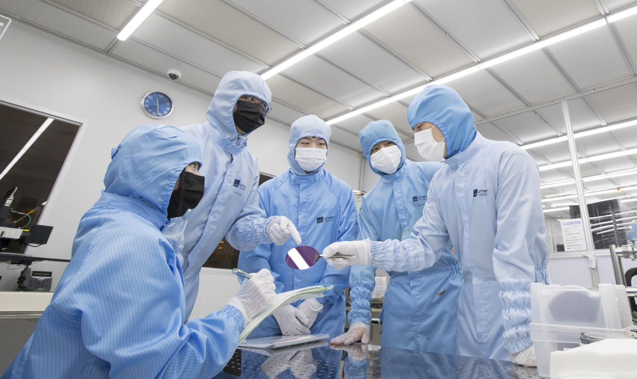 Students in UNIST's semiconductor engineering department discuss research and development. The program recorded the highest competition ratio in the university's 2027 early admissions cycle. [UNIST]