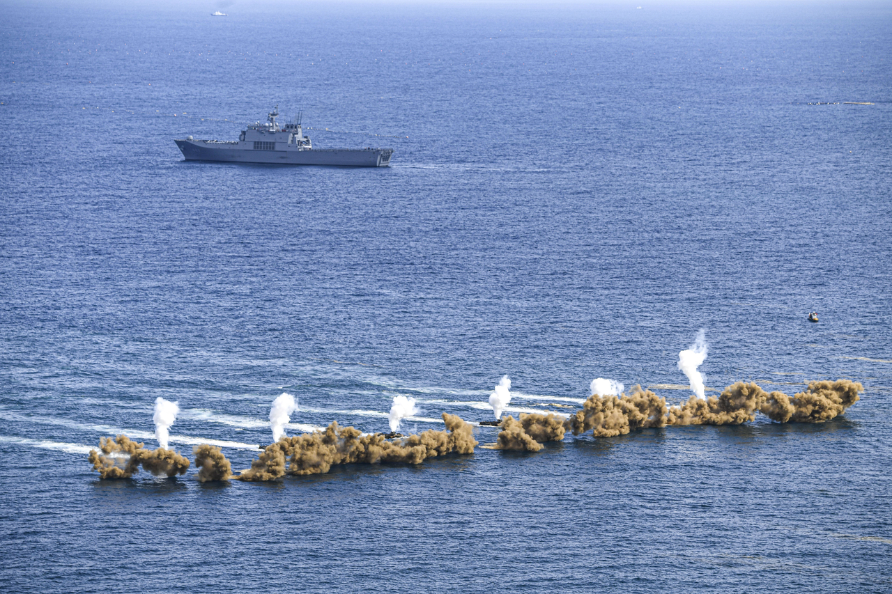 Amphibious assault vehicles of the Marine Corps detonate smoke grenades during the regular joint amphibious landing exercise with the Navy, off the coast of Pohang, about 270 kilometers southeast of Seoul, on Tuesday, in this photo provided by the Marine Corps. (Yonhap)