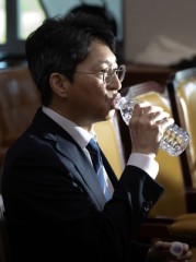 Hong Ji-sun, nominee for land minister, drinks water at confirmation hearing