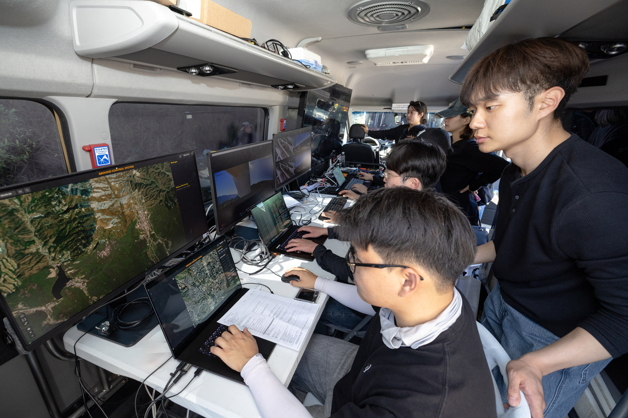 Korean Air demonstrates AI drone swarm flight and swarm strike technology at the 2026 Defense Drone Technology Exhibition held Wednesday at Seungjin Training Ground in Pocheon, Gyeonggi Province. [Korean Air]