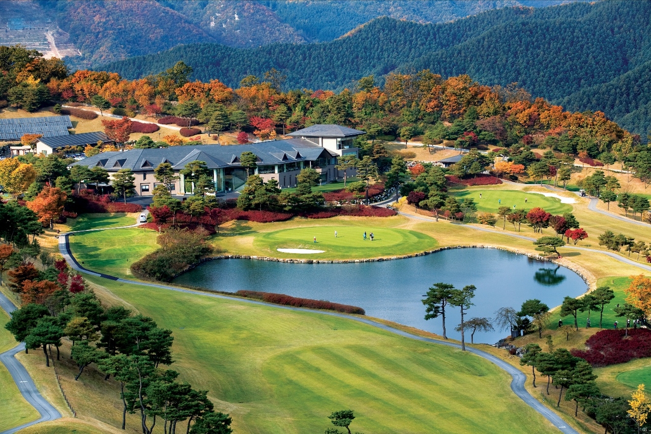 Elysian Gangchon Golf Club, set against a backdrop of sweeping natural scenery.