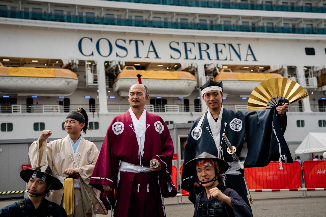 Members of the Nagoya Omotenashi Bushotai traditional samurai performance group pose in front of the Costa Serena cruise ship following its arrival at the Port of Nagoya in Nagoya, Aichi prefecture on September 15, 2026. (Yonhap-AFP)
