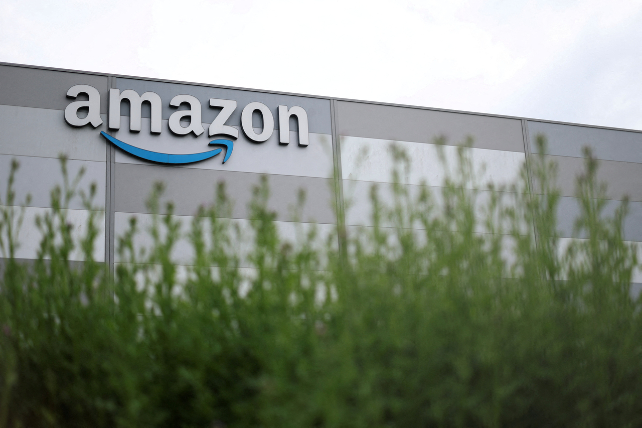 The Amazon logo at a logistics center in Carquefou, near Nantes in western France, in May. [Reuters]