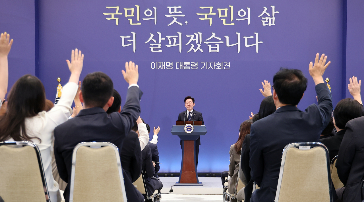 President Lee Jae Myung takes questions from reporters during a news conference at Cheong Wa Dae, on Friday. (Yonhap)
