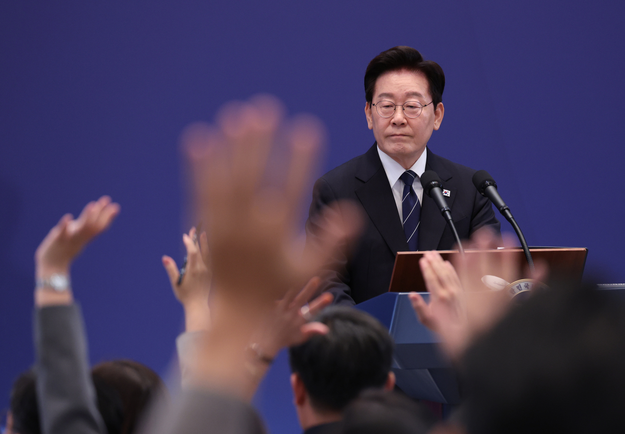 President Lee Jae Myung takes questions from reporters during a press conference at Cheong Wa Dae in Seoul on Friday. (Yonhap)