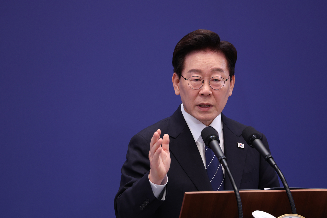 President Lee Jae Myung answers reporters' questions at a press conference held at the Yeongbingwan of Cheong Wa Dae on Friday. [Yonhap]