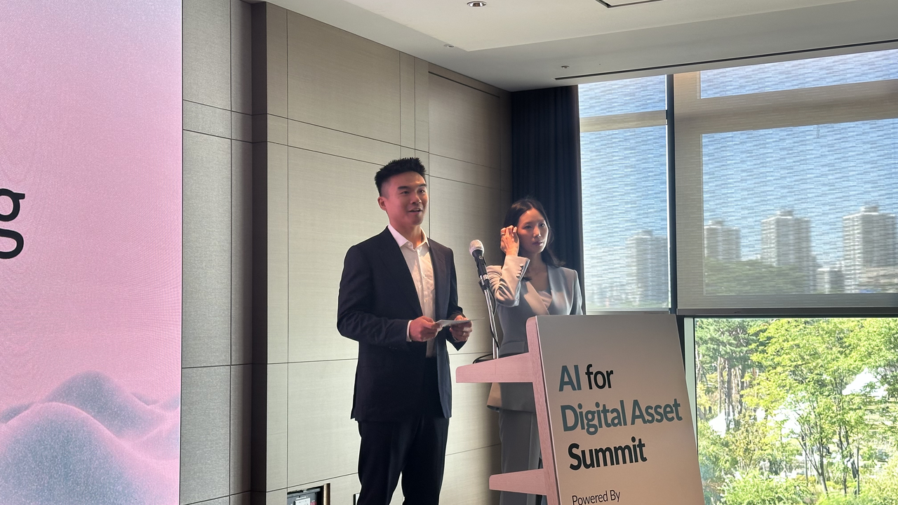 Ryan Lee, co-founder of Surf AI (left), and Park Seo-hyun, Surf AI's Korea head, speak at the 2026 Digital Asset AI Summit held at Sofitel Ambassador Seoul in Songpa-gu, Seoul, on Thursday.