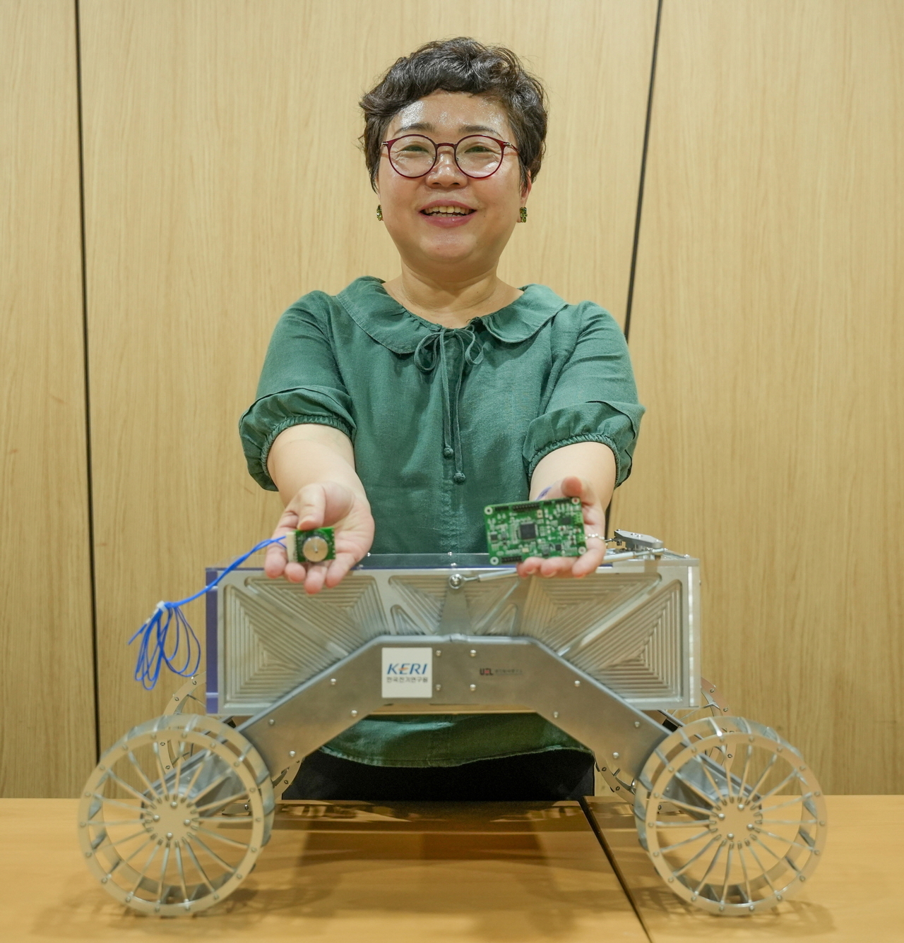 Dr. Lee Ji-young poses with a rover motor and power conversion device. [Korea Electrotechnology Research Institute]