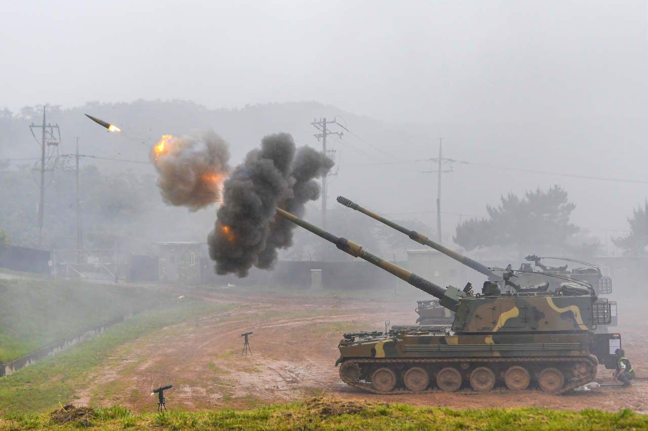 Two K9 self-propelle howitzers are seen joining a live-fire drill in Yeonpyeongdo near the Northern Limit Line in June. (Courtesy of Marine Corps.)