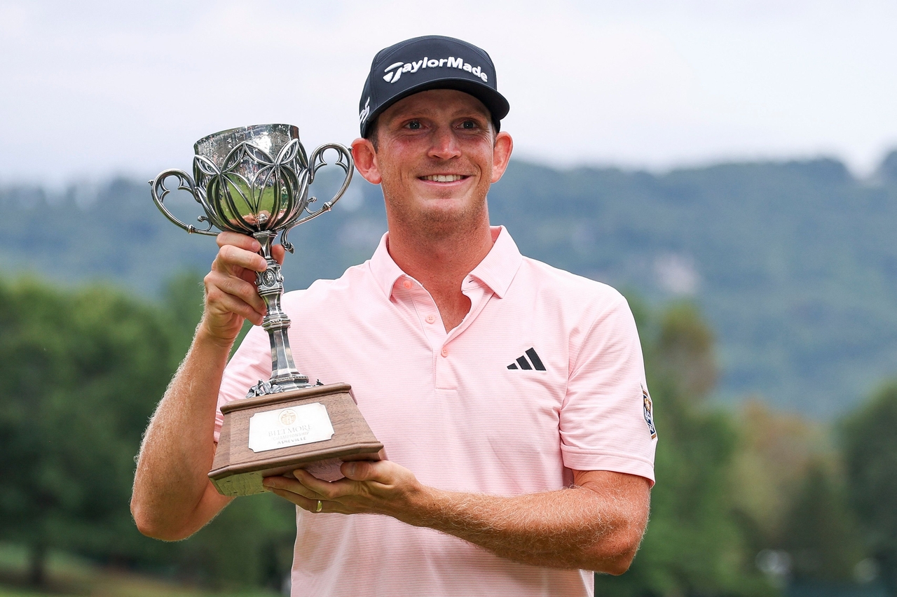 Jacob Bridgeman of the United States poses with the trophy after winning the 2026 Biltmore Championship Asheville at The Cliffs at Walnut Cove in Arden, North Carolina, on Monday. [AFP]