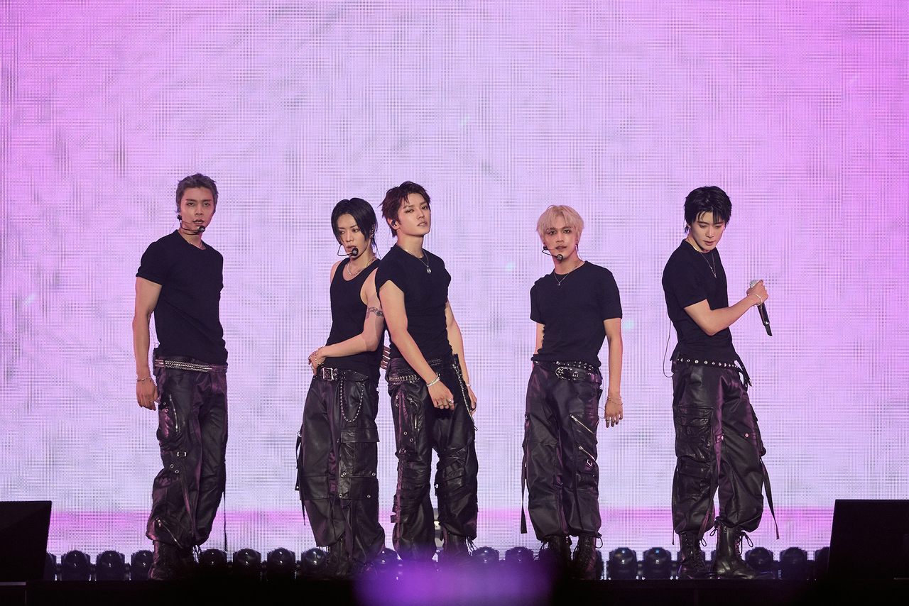 NCT 127 performs during “The Redline,” held at KSPO Dome in Jamsil, southern Seoul, Sunday. (SM Entertainment)