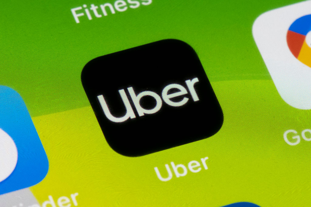 An Uber app is displayed on an iPhone. (Getty Images)