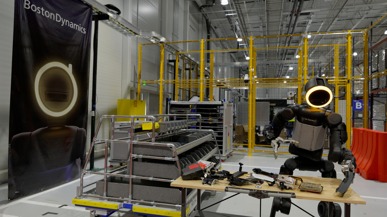 A Boston Dynamics Atlas humanoid robot trains on automotive manufacturing tasks at the Robotics Metaplant Application Center. [Hyundai Motor Group]