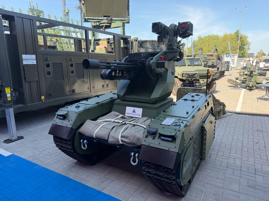 A THeMIS unmanned ground vehicle equipped with a 12.7 mm multi-barrel machine gun (Milrem Robotics)