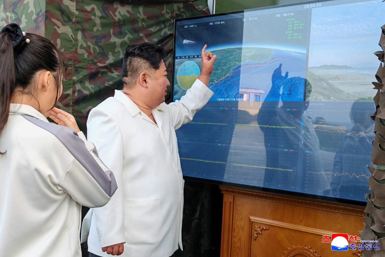 North Korea's Missile Administration tested a new type of weapon on  Sunday, with leader Kim Jong-un and his daughter Ju-ae observing the test, the Korean Central News Agency reported Tuesday. A monitor shown in a photo released by state media displays the words "Hwasongpho-11Ma-1 flight trajectory." (KCNA-Yonhap)