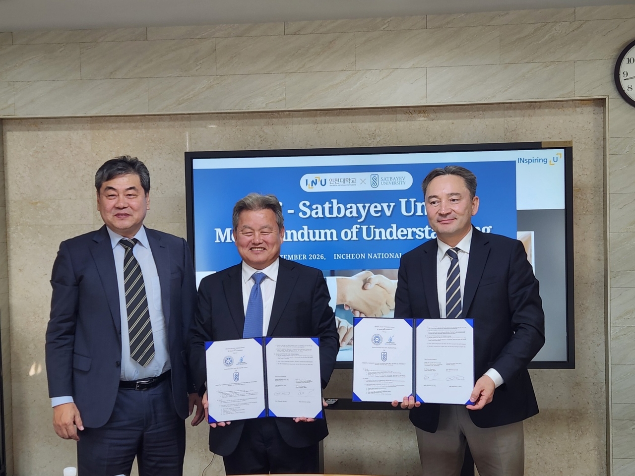 From left: Incheon National University President Lee In-jae, professor Lee Hee-kwan of Incheon National University, and Rector of Satbayev University Meiram Begentayev pose for a photo after signing a memorandum of understanding. (Incheon Innovation Cluster)