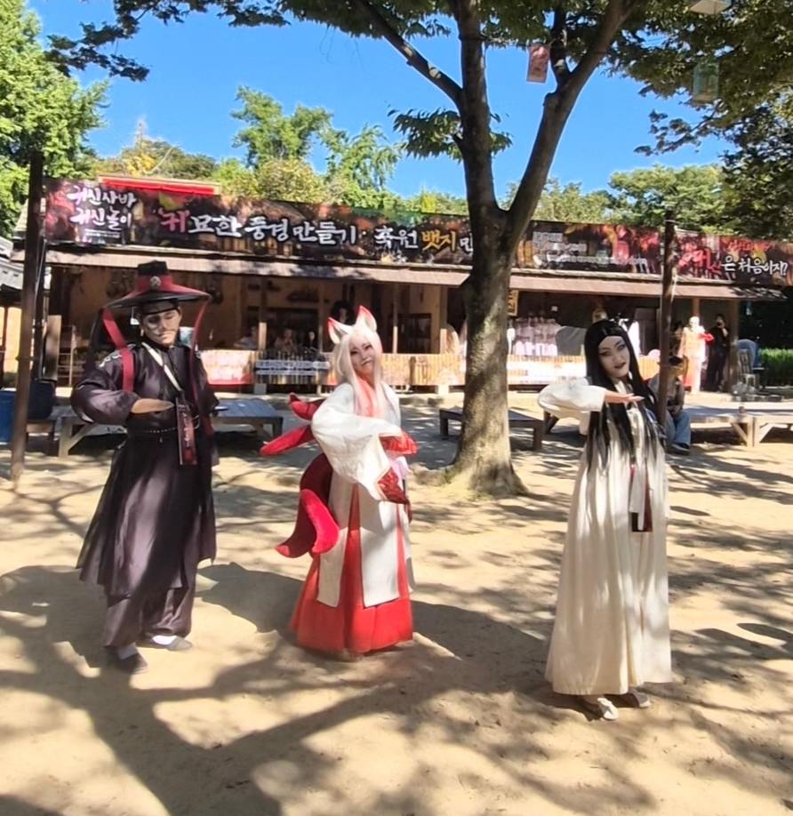 Performers playing a grim reaper, a gumiho and a virgin ghost dance together to Ateez’s “Bad” at the Korean Folk Village on Sept. 15. (Choi Jae-hee / The Korea Herald)