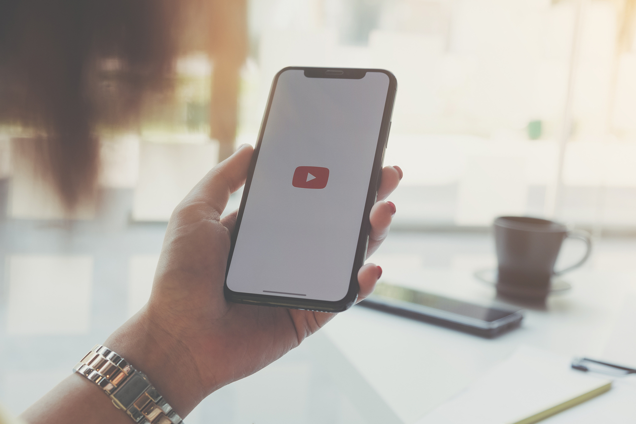 A stock photo of a person accessing YouTube via smartphone. (123rf)