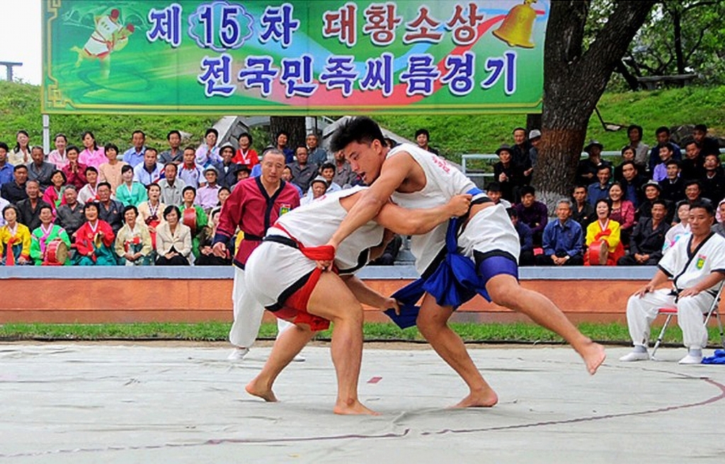 North Korean wrestlers compete in the 15th Grand Bull Prize National Ssirum Contest on Rungna Island in Pyongyang, in footage aired by Korean Central Television on Chuseok, Sept. 24, 2018. (Korean Central Television/Herald DB)