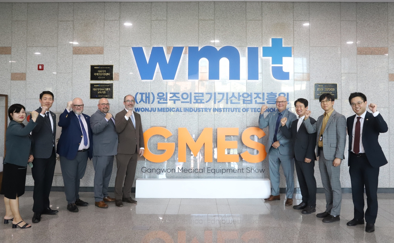 Representatives from Gangwon Province and Alberta pose together in a show of solidarity.