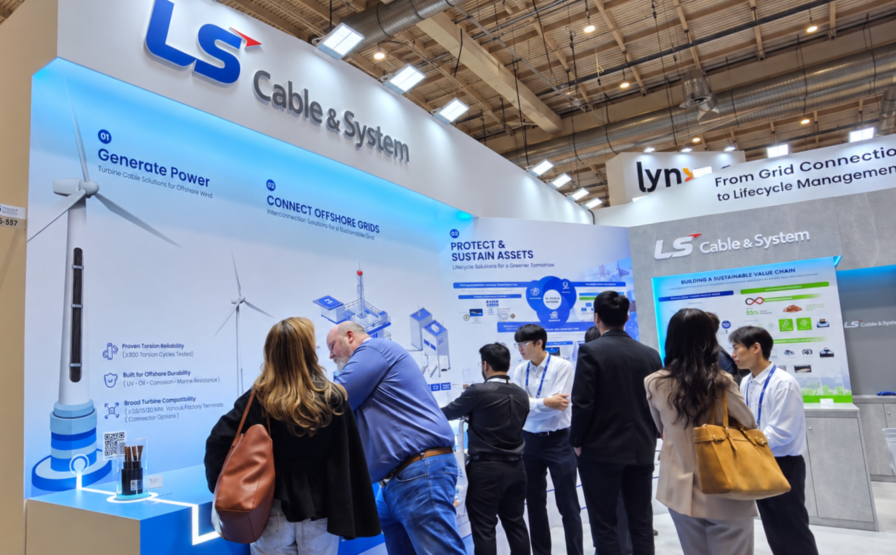 A visitor looks around the LS Cable & System booth at WindEnergy Hamburg 2026. [LS Cable & System]