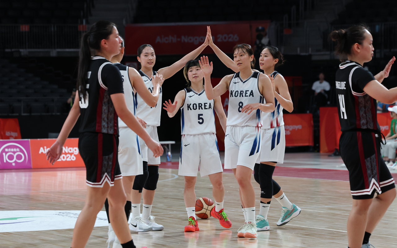 South Korea players celebrate after defeating Indonesia 101-59 in the women's basketball quarterfinal at the 2026 Aichi-Nagoya Asian Games at Aichi International Arena in Nagoya, Japan, on Thursday. [Yonhap]
