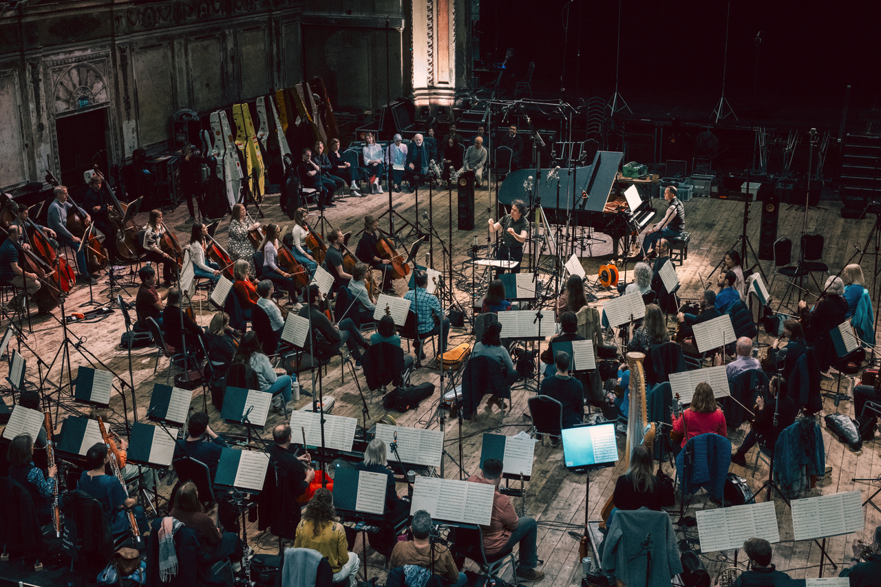 A recording session for Hopkins' debut album, with Gustavo Dudamel and members of the Philharmonia Orchestra. [Universal Music]