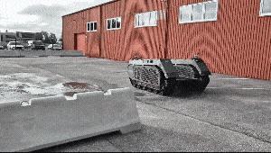Milrem Robotics’ THeMIS unmanned ground vehicle moves through the parking lot outside the company’s headquarters in Tallinn, Estonia. (Milrem Robotics)