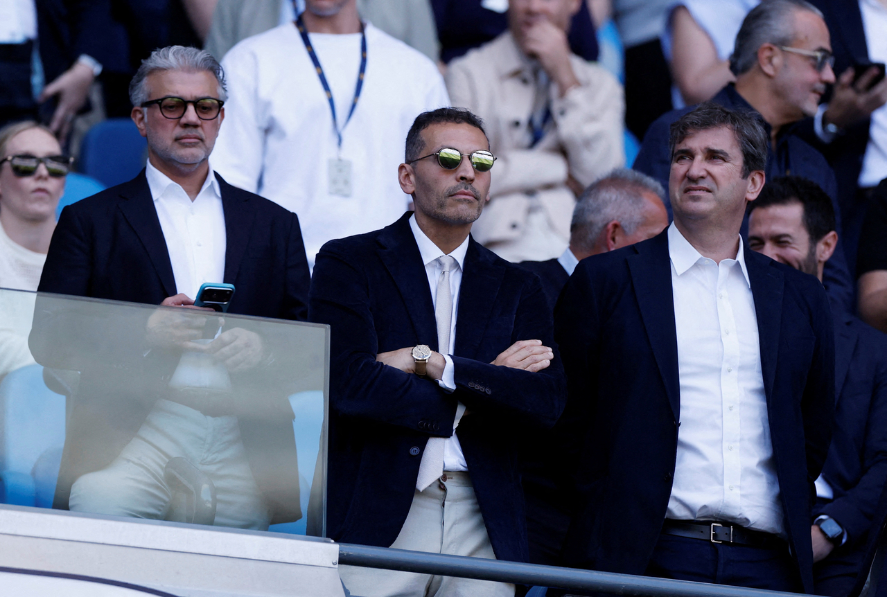Manchester City chairman Khaldoon Al Mubarak (center) and chief executive Ferran Soriano (right) watch from the stands, during a match between Manchester City and Aston Villa, at the Etihad Stadium in Manchester, England, May 24.    (Reuters-Yonhap)