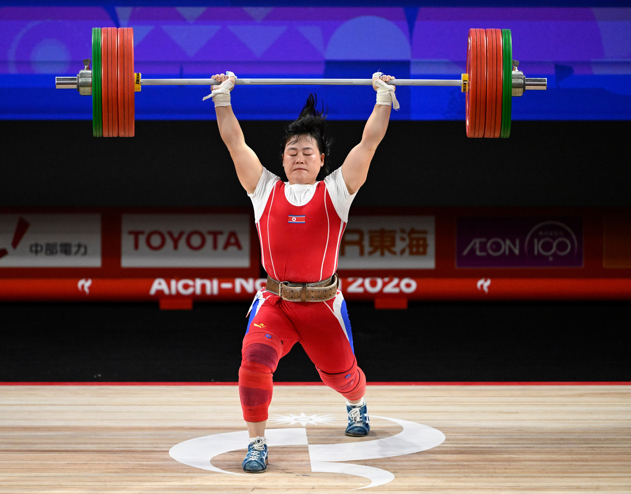 North Korea's Song Guk-hyang lifts a barbell during the women's 69 kg final at the 2026 Aichi-Nagoya Asian Games in Nagoya, Japan, on Sunday. [Xinhua]